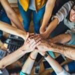team aligned holding hands